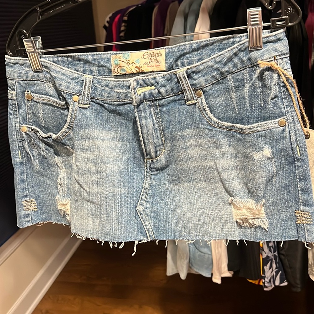 New denim short skirt with fringe style